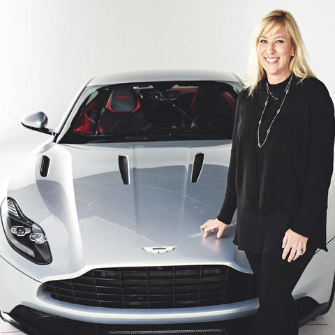 Laura Schwab, president of Aston Martin the Americas, with the DB11. Photo Credit: Aston Martin