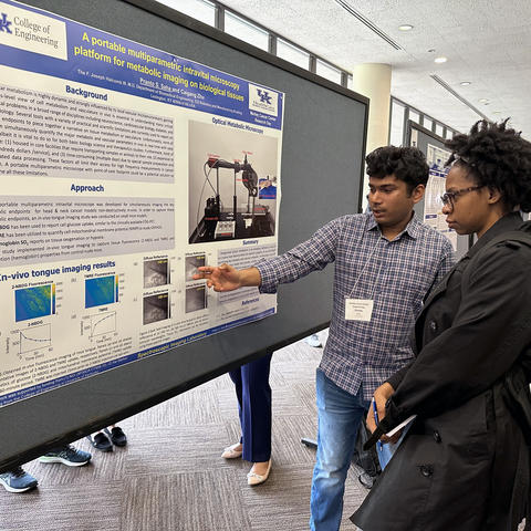 Researcher sharing work during Markey Research Day.