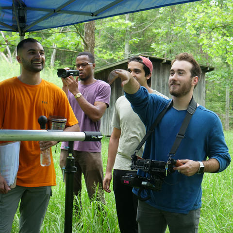 Matthew Dunlap (right) and his crew work on the set of Burning In Trial on location in the Red River Gorge.
