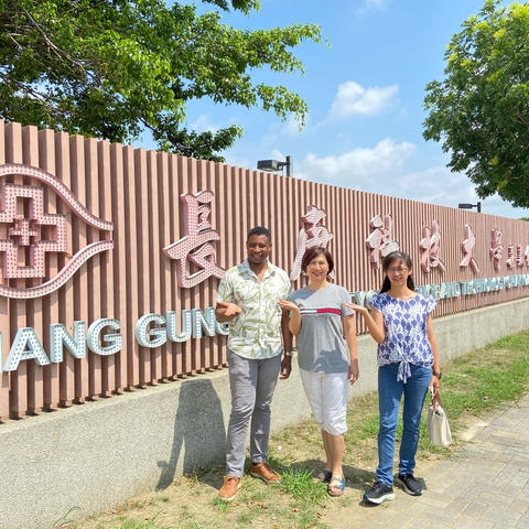 Dr. Okoli (left) in front of CGUST.