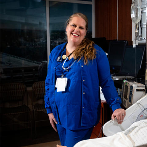 Photo of Shannon Beebe with a simulation dummy