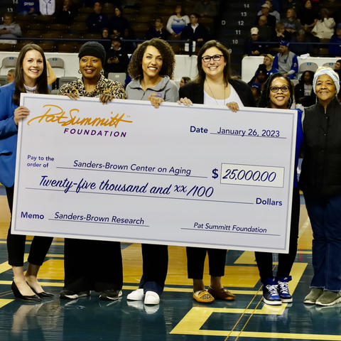 The Pat Summitt Foundation presented a $25,000 check to UK's Sanders-Brown Center on Aging during the women's basketball game on Jan. 26, 2023. Photo by James Haggie
