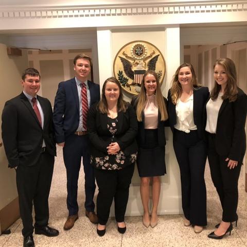 Six UK Law Moot Court Team Students dressed in professional attire