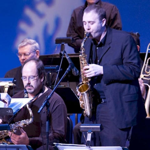 photo of BAJA sax player soloing at holiday concert