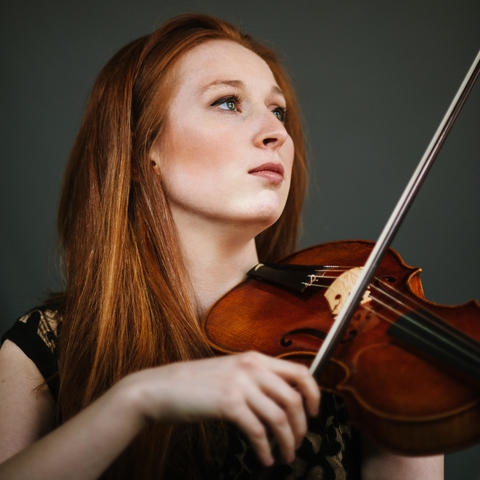 photo of Augusta McKay Lodge with violin and bow