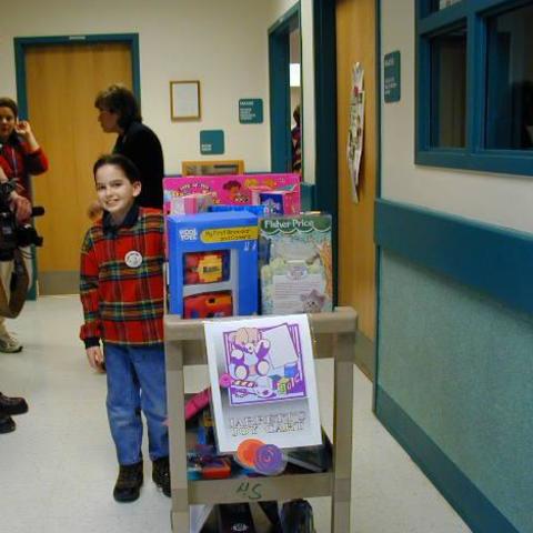 image of Jarrett with his cart of toys in 1999