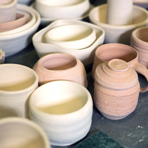 photo of ceramic bowls, mugs, vases