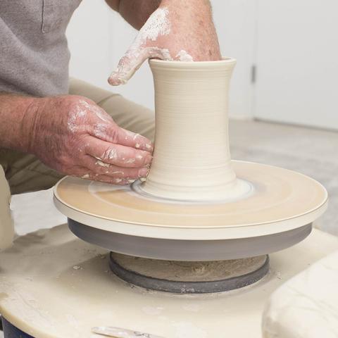 photo of hands working on ceramic vase - Fine Arts Institute
