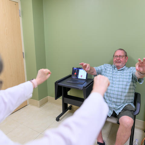 Hoyt “Corky” Ball going through some assessments at a routine DBS-Plus follow up appointment with Julie Gurwell, Ph.D. Photo by Shaun Ring.