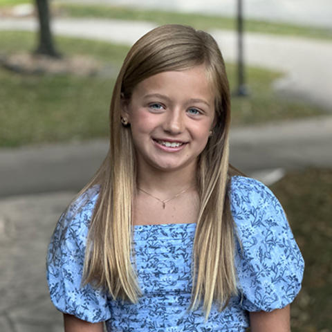 Image of Harper wearing a blue dress