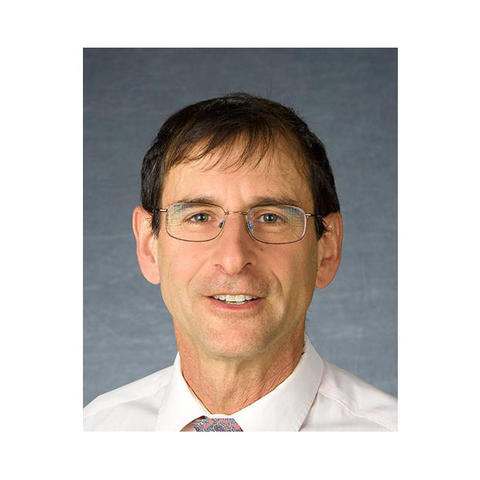 Staff photo of Paul Vincelli in white shirt and glasses