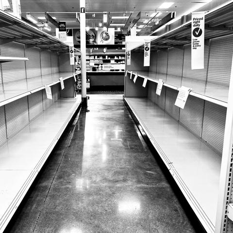 black and white photo of empty store shelves from "In This Together"