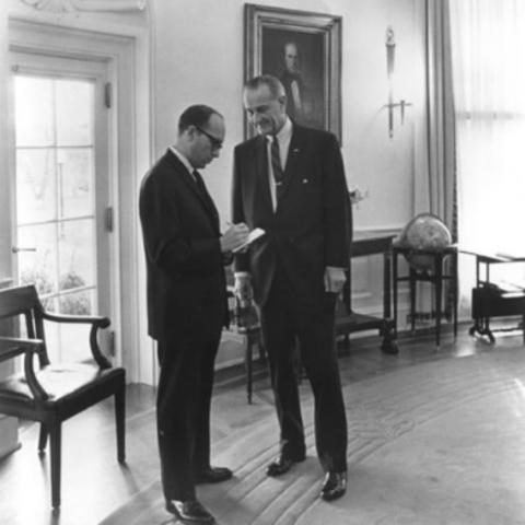black and white photo of Sid Davis interviewing LBJ in White House