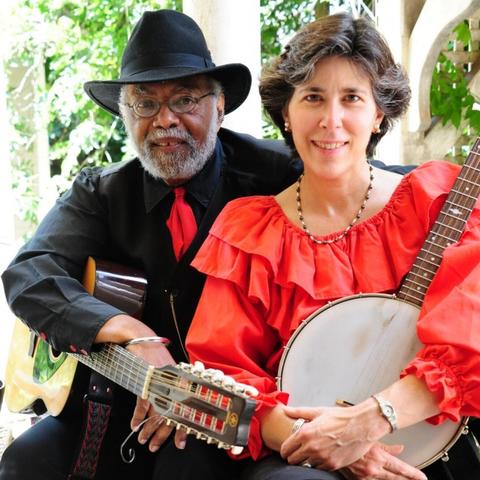 photo of Sparky and Rhonda Rucker holding instruments