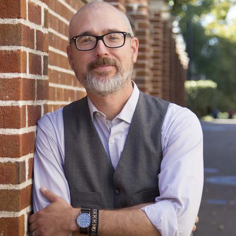headshot photo of Eric Weig next to King Library